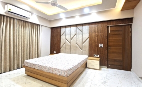 modern bedroom with large bed featuring